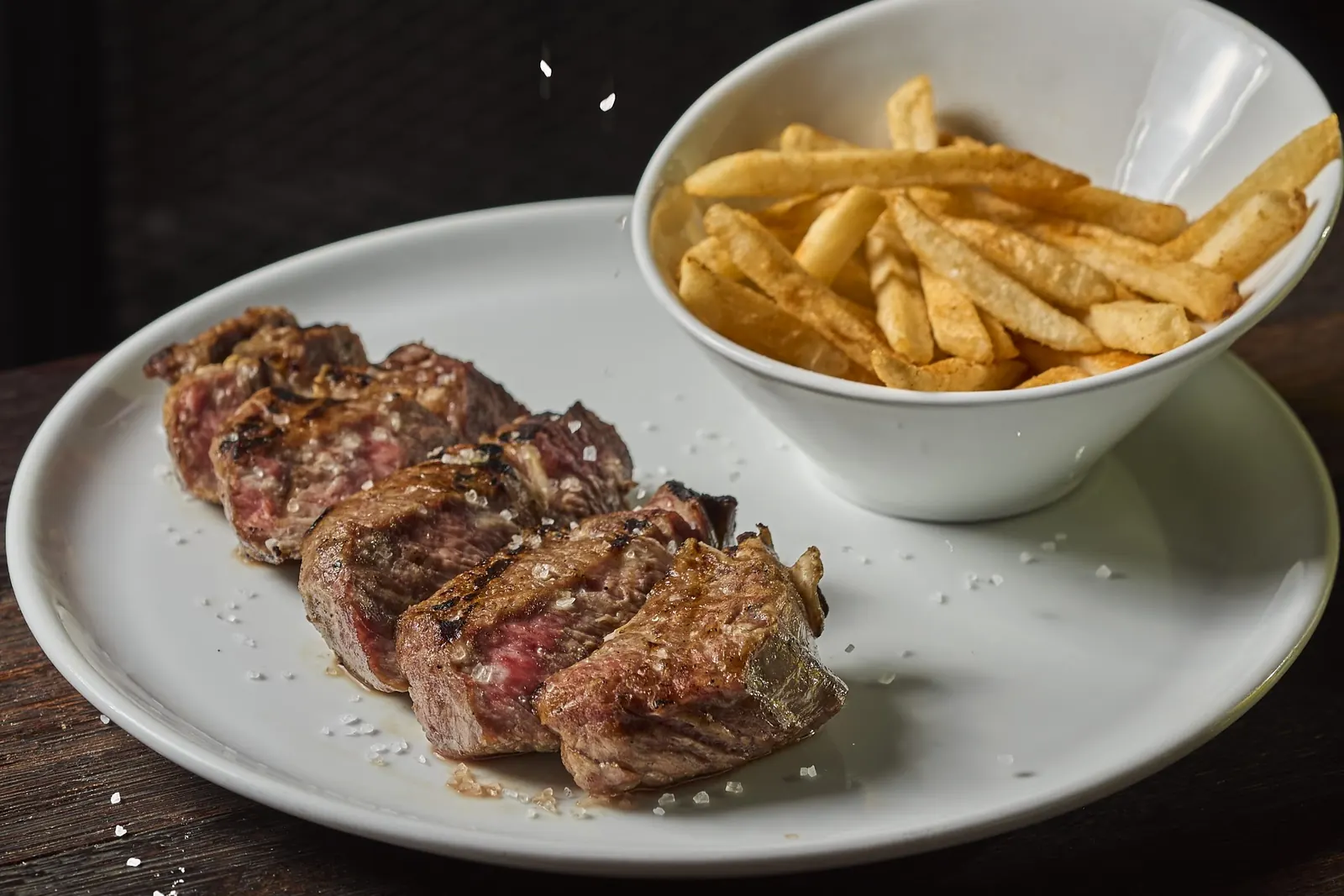 Sliced beef steak with fries at Bastión Bistró